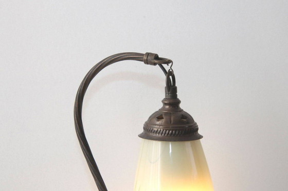 Image 1 of Vintage brass table lamp with curved arm and glass shade