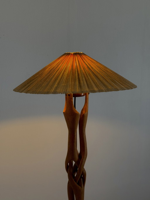 Sculptural hand-carved table lamp made of solid teak wood