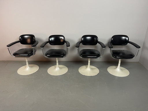 A striking set of four vintage swivel dining chairs attributed to Rudi Verelst for Novalux, Belgium.