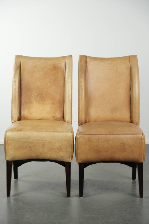 6 chaises de salle à manger en cuir de vachette clair, avec une belle couleur claire, une assise confortable et un dossier haut.