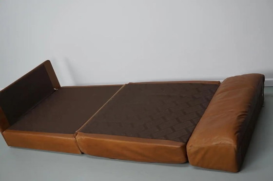 Image 1 of De Sede DS 76 loungestoel / slaapbank van cognackleurig leer, Zwitserland, jaren 1970