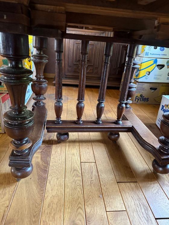 Image 1 of Antique, oak extendable table and 8 matching chairs on casters