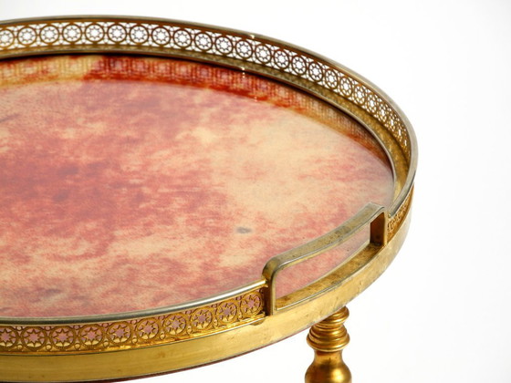 Image 1 of Round, small 1960s Aldo Tura serving or bar trolley in red goatskin leather | Made in Italy