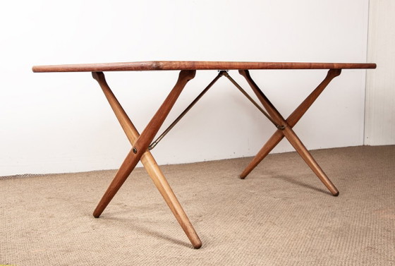 Image 1 of Deense eettafel van massief teak en beukenhout met messing, model AT 303, ontworpen door Hans Wegner voor Andreas Tuck in 1960.