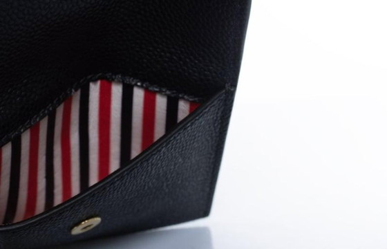 Image 1 of Thom Browne, pochette in pelle martellata con portafoglio