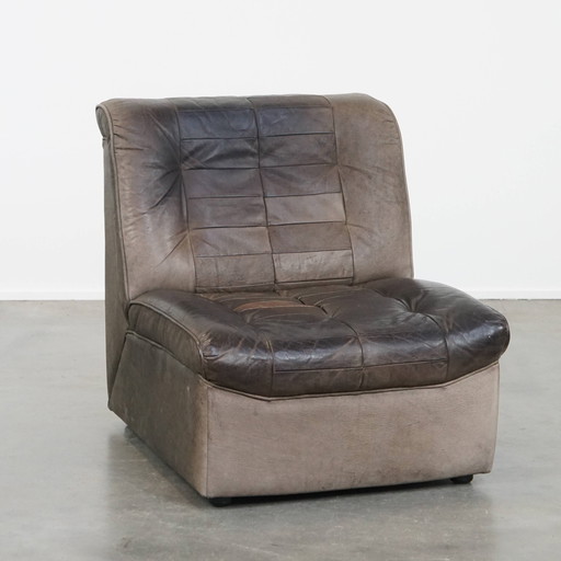 Fauteuil design en cuir vintage gris