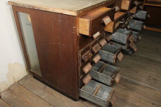 Image 1 of Antique industrial apothecary cabinet • Vintage wood and metal drawer cabinet with many compartments