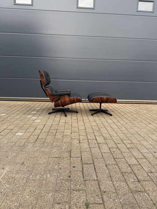 Poltrona lounge Vitra Eames XL + poggiapiedi, in pregiata pelle nera e palissandro Santos. NUOVA!!