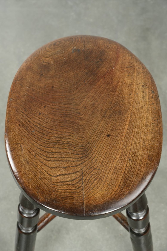 Image 1 of Antique English Windsor stool from the early 19th century with a unique oval shape