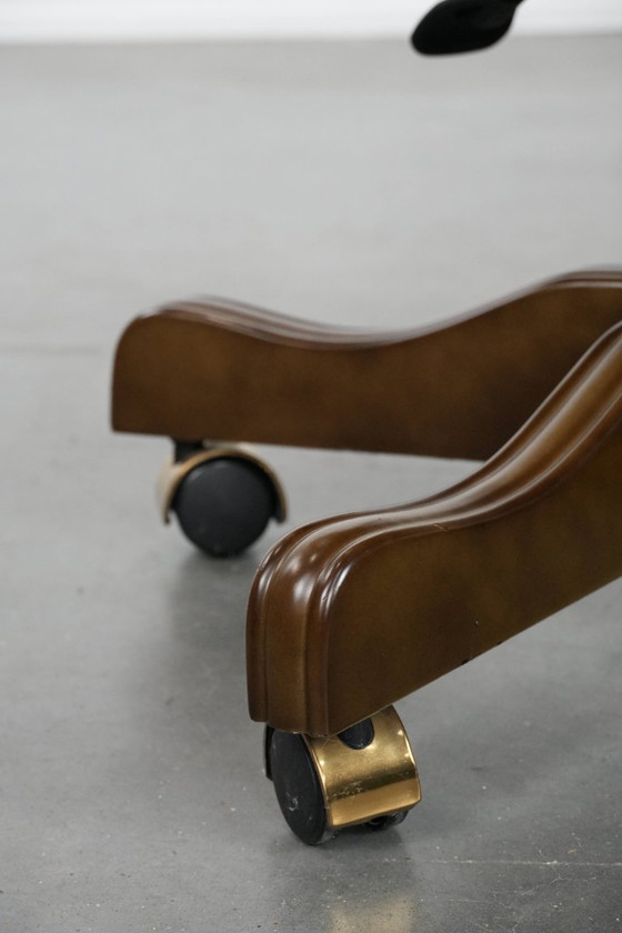 Image 1 of English-style Chesterfield office chair made of cowhide and wood on wheels