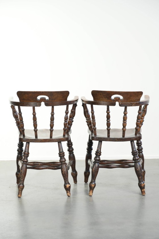 Image 1 of 2x antique English wooden pub/captain chairs from the late 19th century with character and a beautiful color scheme