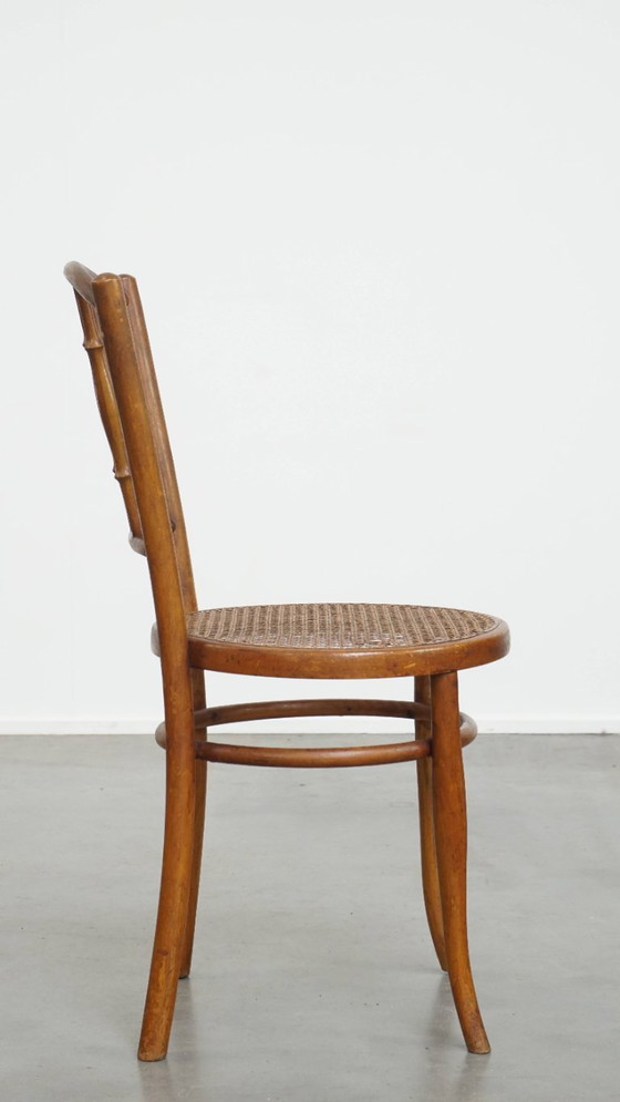 Image 1 of Vintage bistro stoel in de stijl van Thonet met een rieten zitting