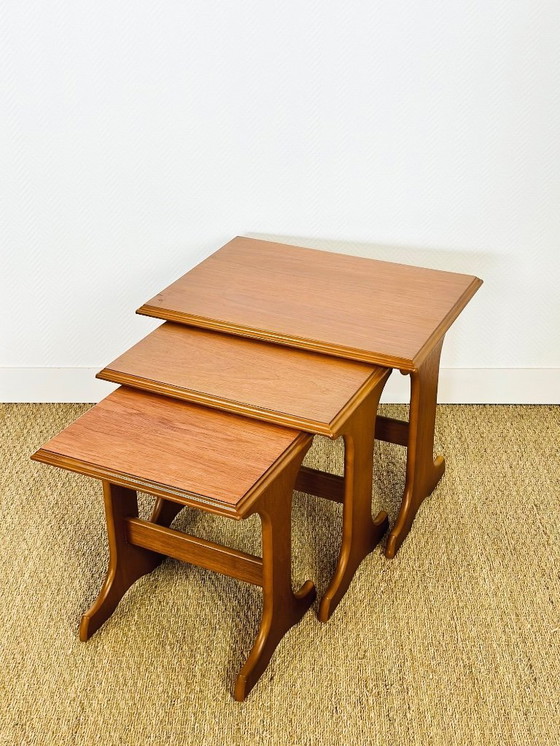 Image 1 of Set van 3 Scandinavische in elkaar passende salontafels van teakhout, 1960