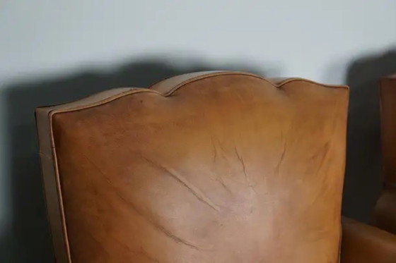 Image 1 of Set Franse cognackleurige leren clubfauteuils met ‘moustache’-rugleuning, jaren 1950