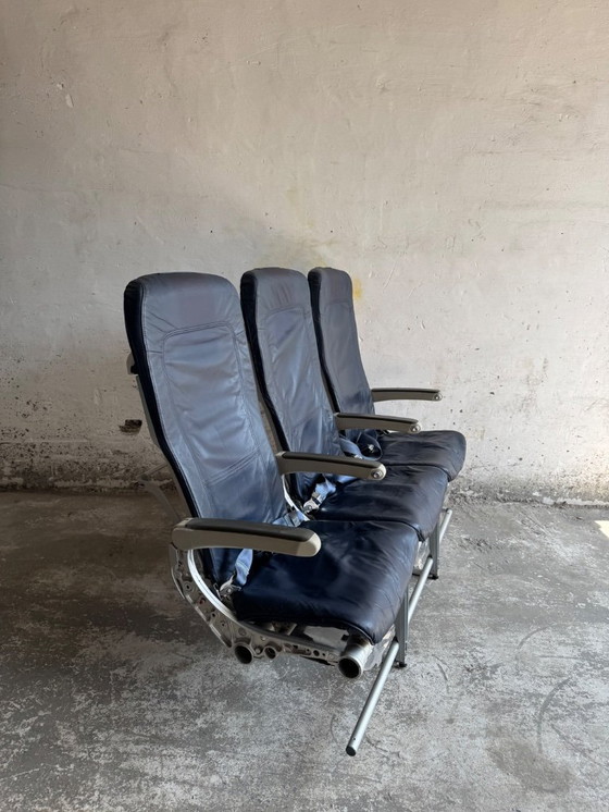 Image 1 of Vintage driepersoons vliegtuigstoelen - Recaro