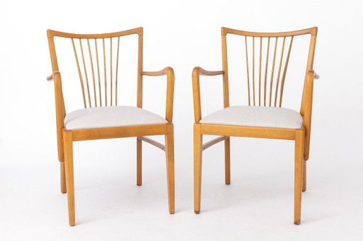 Par de sillones vintage de los años 50, de madera de haya restaurada y tapicería gris claro, sillas de comedor o escritorio