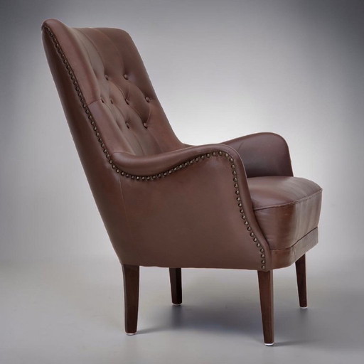 Anni '70, poltrona danese, rivestimento originale in pelle marrone.
