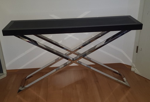 Tavolo consolle con piano bordato in pelle