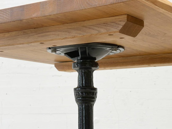 Image 1 of Bistro table made of acacia wood with a cast iron base in country style