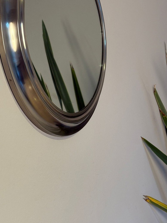 Image 1 of round mirror with metal frame, dating back to the 1970s