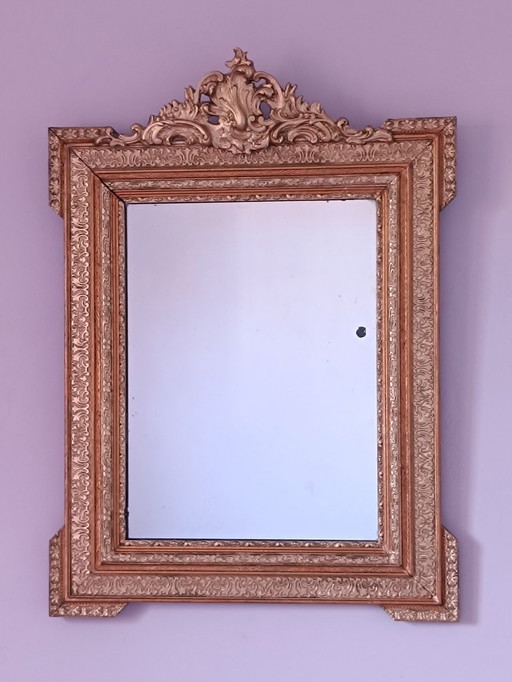 Napoleon III mirror with rich gilded ornamentation