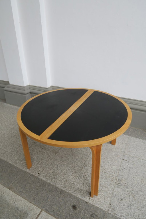 round dining table by Rud Thygesen and Johnny Sorensen for Magnus Olesen