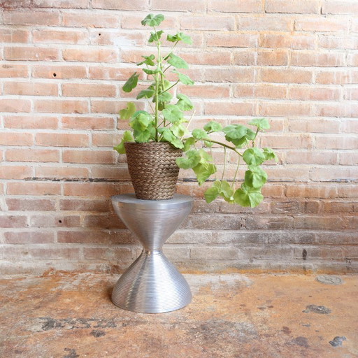 Vintage stool/side table made of cast metal, hourglass shape, chrome trend