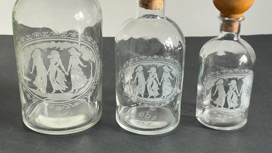 Image 1 of Vintage Engraved Glass and Wood Bottles
