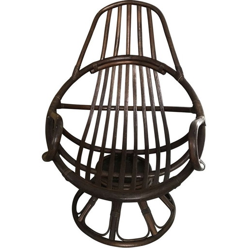 Poltrona girevole vintage in rattan con cuscino