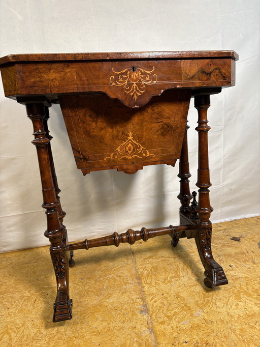 A Romantic Victorian Burr Walnut Sewing & Work Table Mid–Late 19th Century  Rich with the charm of a bygone age, this exquisite 