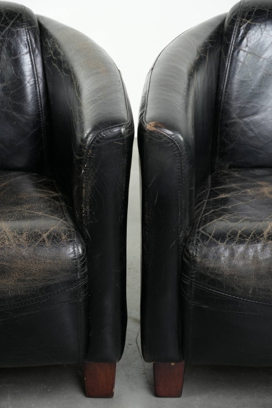 Image 1 of 2x rugged black vintage cowhide Aviator design armchairs with a distinctive look