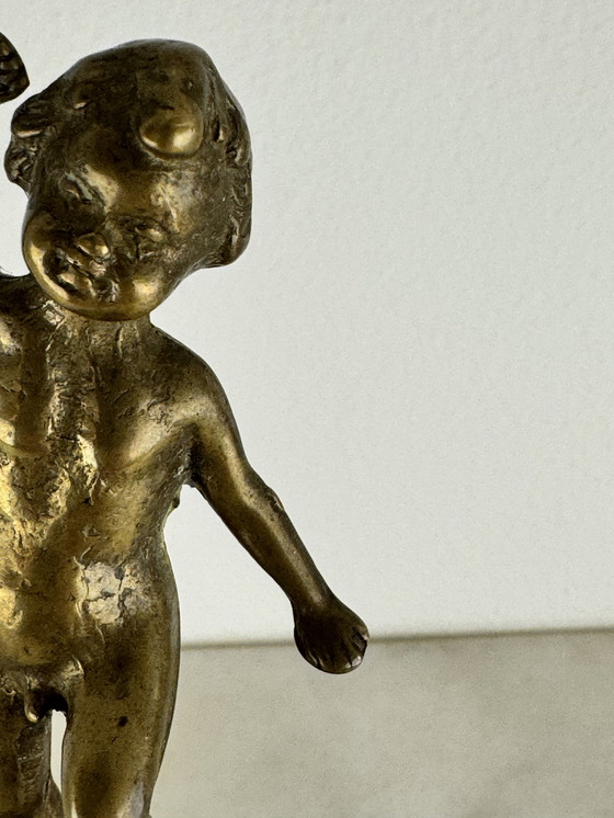 Image 1 of Antique bronze figurine of playing child - decorative and rare