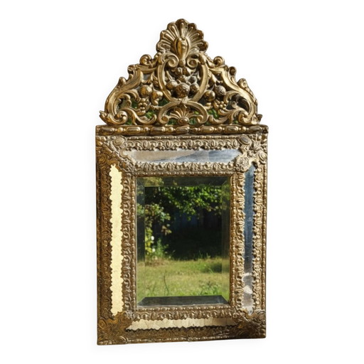 Mirror with brass repoussé frame, Louis XIV style
