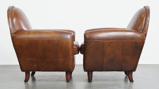 2 x Fauteuil design en cuir de bœuf aux formes arrondies