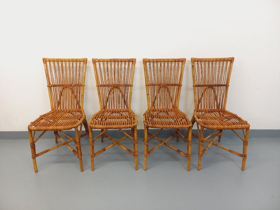 Image 1 of Suite de 4 chaises vintage Audoux Minet en rotin des années 50 60