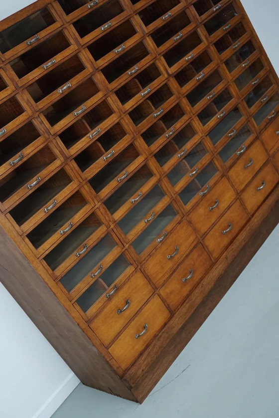 Image 1 of Großer, antiker deutscher Kurzwarenladenschrank aus Eiche, 1940er Jahre