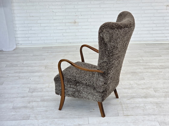 Image 1 of 1960s Reupholstered Danish Armchair with Stool, Genuine Sheepskin