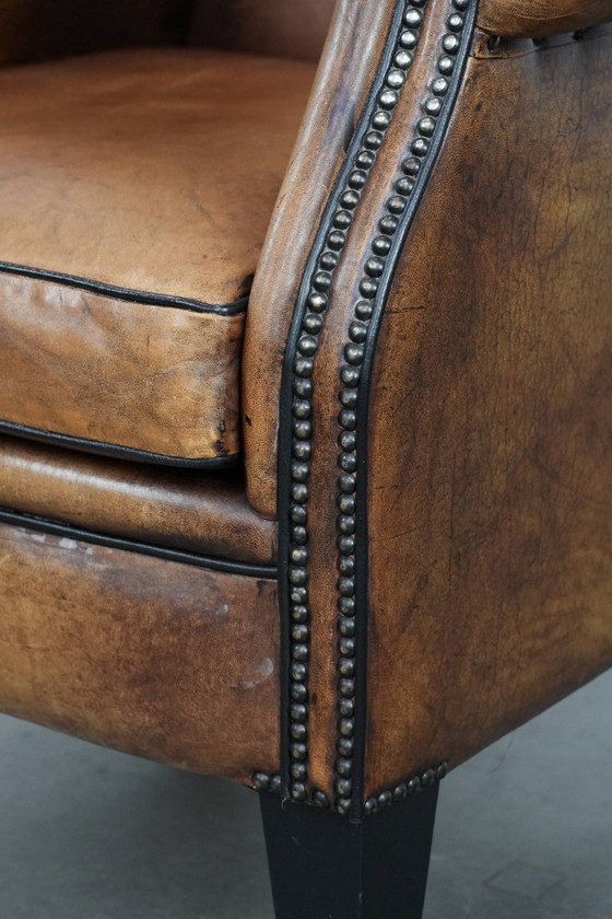 Image 1 of Sheepskin wing chair with a characterful appearance