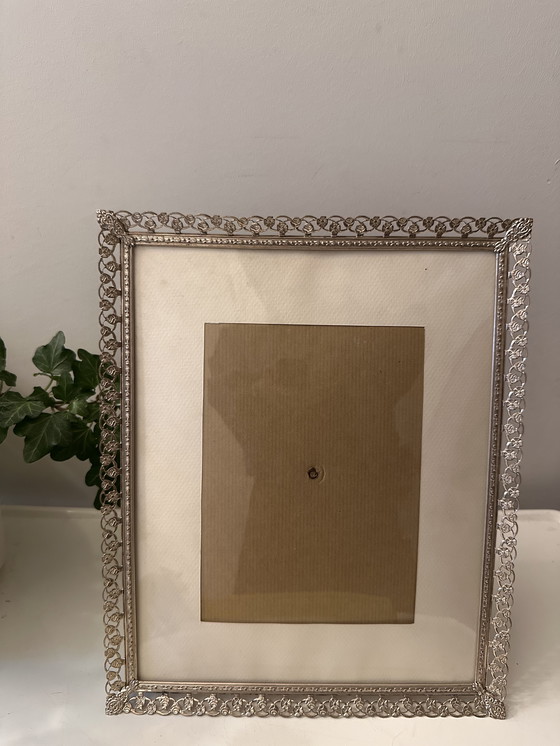 Image 1 of Marco de fotos de los años 60 con cristal ligeramente curvado.