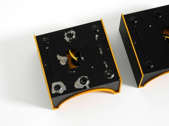 Image 1 of A rare pair of original 1960s Space Age metal wall lamps by Klaus Hempel for Kaiser Leuchten in yellow and black