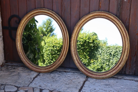 Image 1 of Pair of oval Louis Philippe period mirrors in giltwood