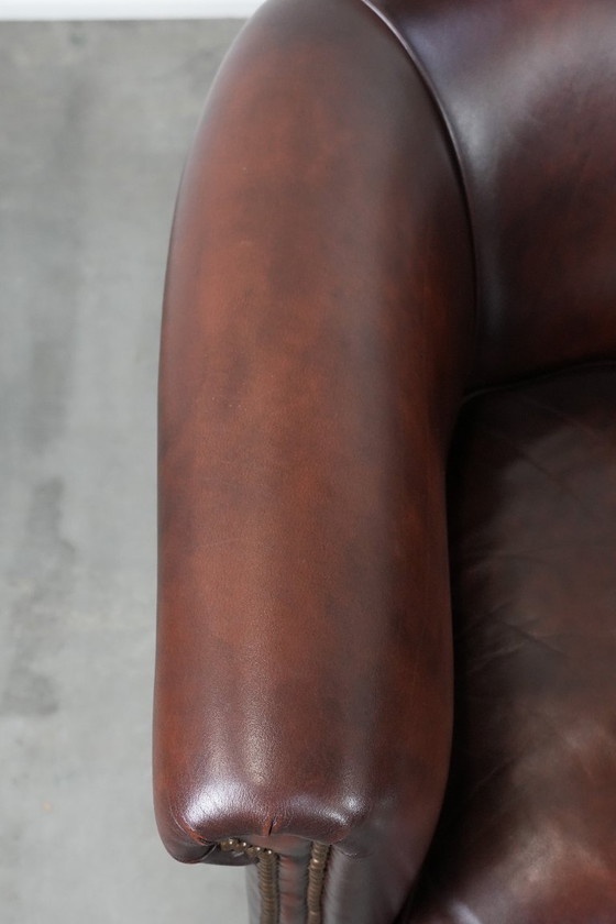 Image 1 of 2 poltrone club in pelle bovina in buone condizioni, di un lussuoso colore rosso/marrone.