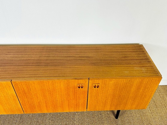 Image 1 of Minimalist Scandinavian sideboard in teak with black metal legs, 1960