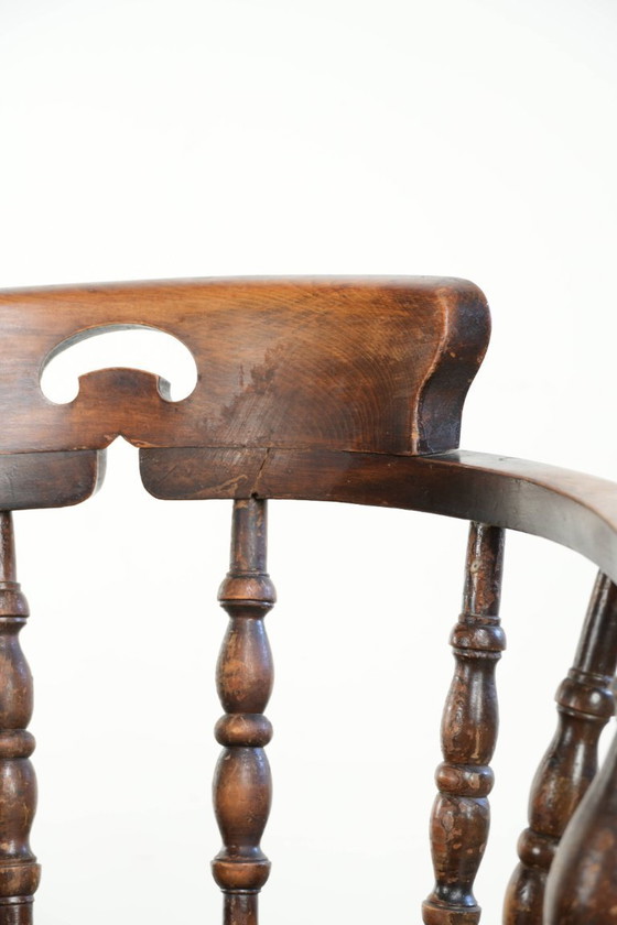 Image 1 of 2x antique English wooden pub/captain chairs from the late 19th century with character and a beautiful color scheme