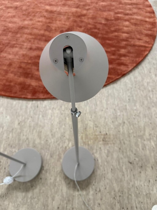 Two Philips floor lamps in gray