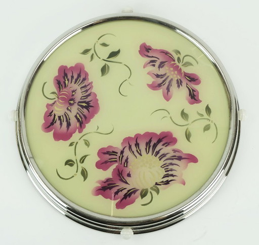 Plat à gâteau rotatif des années 1930, en verre chromé, orné de fleurs roses et violettes.