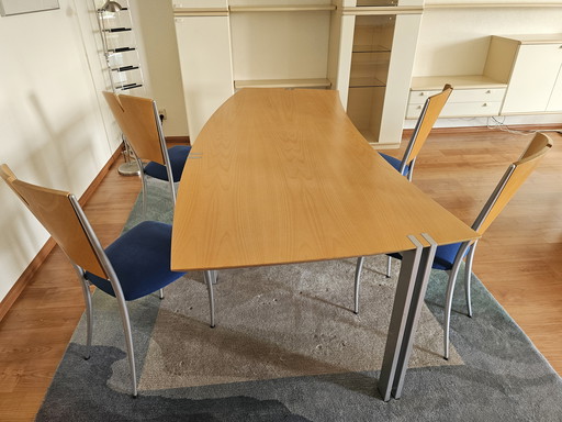 Dining table with matching chairs and rug