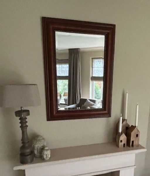 Miroir avec cadre en bois fin et bord facetté poli