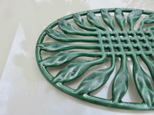 Large oval green enameled cast iron trivet, France, 1960s