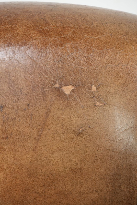 Image 1 of Vintage sheepskin club armchair with beautiful colors and finished with decorative nails.